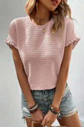 elegante blusa rosa claro con volantes