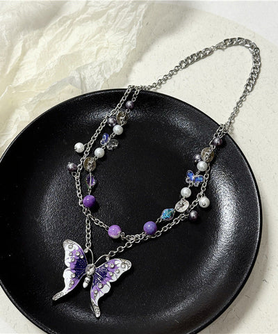 Collar de lazo con borla hueca y mariposa de circonita y cristal de acero inoxidable morado a la moda  Collar de lazo con borla hueca y mariposa de circonita y cristal de acero inoxidable morado a la moda