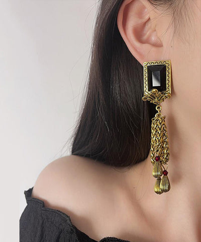 Pendientes retro de plata de ley negra con gemas doradas y borlas con cadena  Pendientes retro de plata de ley negra con gemas doradas y borlas con cadena