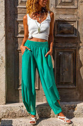 Pantalones hippies de harén de lino y algodón con abertura lateral y botones Meridress