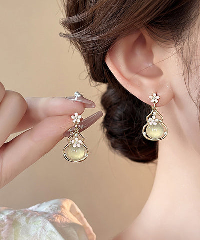 Pendientes colgantes de calabaza con diseño floral de aleación de cobre y oro de moda  Pendientes colgantes de calabaza con diseño floral de aleación de cobre y oro de moda