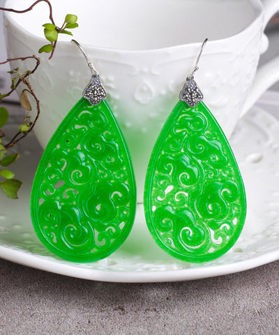 Pendientes colgantes de jade Tocantins con detalles calados en plata de ley dorada retro  Pendientes colgantes de jade Tocantins con detalles calados en plata de ley dorada retro