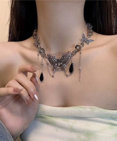 Collar de lazo con borla hueca y mariposa de circonita y cristal de acero inoxidable morado a la moda  Collar de lazo con borla hueca y mariposa de circonita y cristal de acero inoxidable morado a la moda