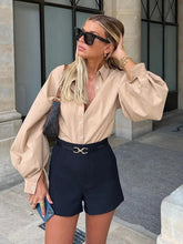 Blusa con cuello abotonado y mangas farol