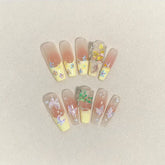 Lange, weiche Kunstnägel in gelbem, passendem Nude-Band mit Strass-Design