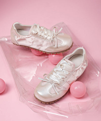 Lässige flache Schuhe mit Schleife und Kreuzriemen aus rosa Kunstleder  Lässige flache Schuhe mit Schleife und Kreuzriemen aus rosa Kunstleder