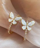 Pendientes de aro con mariposa de circonita y aleación de cobre y oro artístico