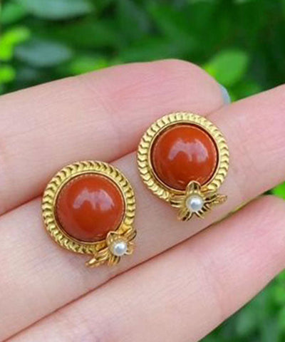 Pendientes de plata de ley roja con ágata dorada y perla. 