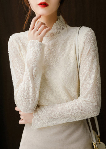Blusa elegante de encaje bordado con huecos en beige para primavera 