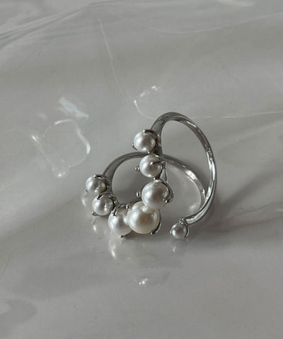 Conjunto de dos anillos de plata de ley con perlas y seda fina 