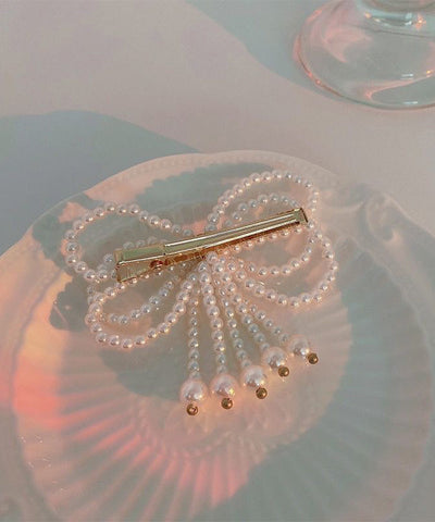 Moderne Haarnadel mit weißer Kristallperlenschleife 