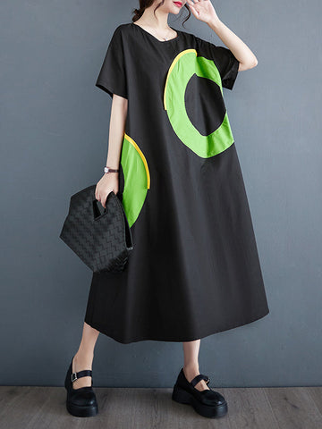Vestidos midi holgados de manga corta con bolsillos de color en contraste y cuello redondo estampados 