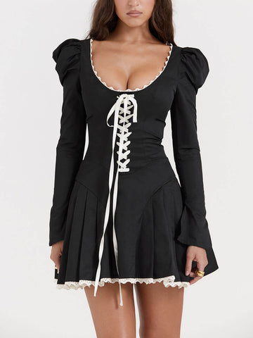Minivestido plisado negro y crema 