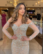 Vestido de fiesta de tul sirena color champán intenso de Ovlias, manga larga, escote corazón, sin tirantes