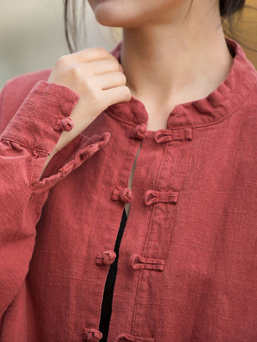 Blusas plisadas de color liso con cuello alto, mangas murciélago y botones de rana chinos sueltos. 