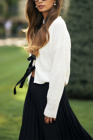 Suéter elegante con cuello en V y lazo en la parte delantera de Meridress