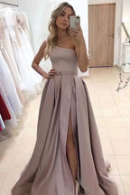 Vestido de fiesta largo color champán con corte A y un hombro al descubierto