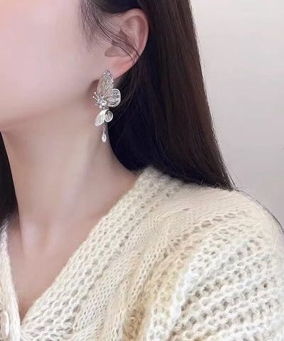 Pendientes de mariposa con circón de cobre y seda fina con agujeros 