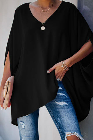 Camiseta holgada de murciélago con cuello en V y media manga de Meridress