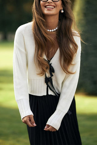 Suéter elegante con cuello en V y lazo en la parte delantera de Meridress