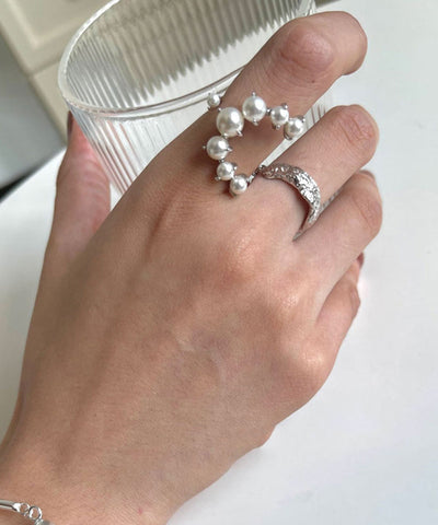 Conjunto de dos anillos de plata de ley con perlas y seda fina 