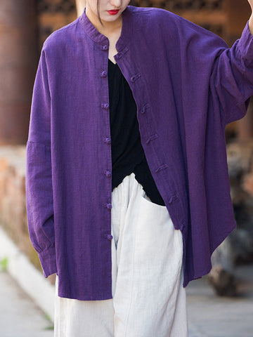 Blusas plisadas de color liso con cuello alto, mangas murciélago y botones de rana chinos sueltos. 