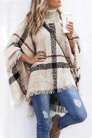 Suéter poncho con borlas y entramado más chic de Meridress
