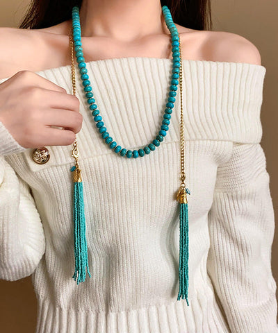Collar vintage de aleación de oro con cuentas turquesas y borlas adornadas 