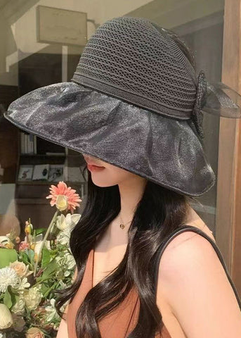 Elegante sombrero de pescador de punto con patchwork y lazo liso en color rosa 