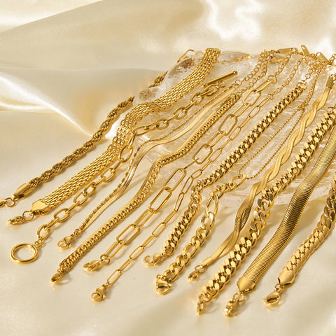 Pulseras de cadena de acero y titanio dorado con hueso de serpiente 