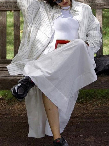 Blusas de solapa a rayas con aberturas laterales, mangas largas y corte irregular 