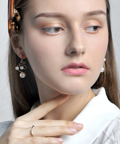 Pendientes colgantes con forma de estrella y perla de cobre blanco Vogue 