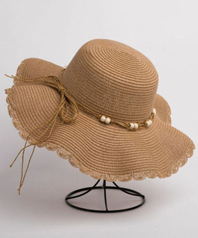 Sombrero para el sol flexible tejido de paja con cuentas de clavo de color caqui y UPF 50+ 