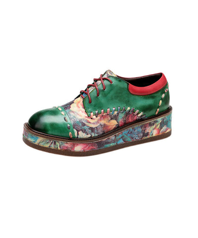 Grüne Boho-Plateauschuhe mit Schnürung und Prägung aus Schaffell 