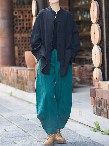 Blusas plisadas de color liso con cuello alto, mangas murciélago y botones de rana chinos sueltos. 