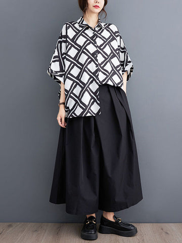 Blusas y camisas con solapas estampadas a cuadros con botones altos y bajos y mangas murciélago 