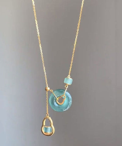 Collar con colgante de calabaza de calcedonia dorada en plata de ley azul con hebilla de seguridad 