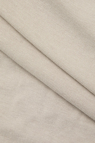 Makala Camiseta sin mangas con pliegues asimétricos en color caqui 