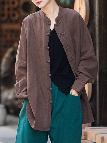 Blusas plisadas de color liso con cuello alto, mangas murciélago y botones de rana chinos sueltos. 