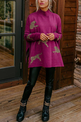Suéter Meridress con cuello alto, abertura lateral y estampado de guepardo