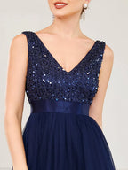 Vestido de noche o de gala de tul y lentejuelas de corte alto y bajo 