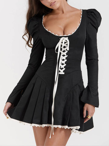 Minivestido plisado negro y crema 