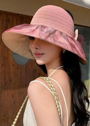 Elegante sombrero de pescador de punto con patchwork y lazo liso en color rosa 