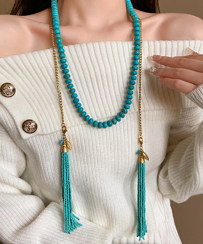 Collar vintage de aleación de oro con cuentas turquesas y borlas adornadas 