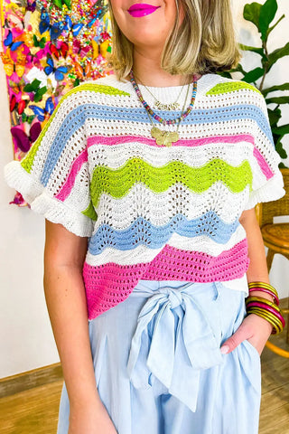 Suéter de punto de crochet multicolor con volantes 