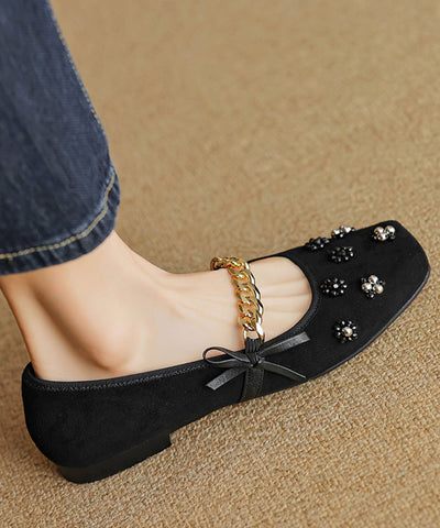 Zapatos planos con lazo y cuentas para mujer de ante negro 