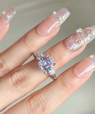 Anillos de cobre y circonitas moradas 
