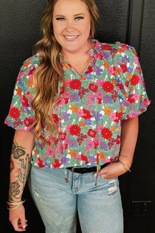 Blusa con mangas abullonadas y estampado floral multicolor vibrante 