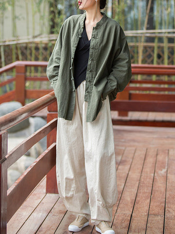 Blusas plisadas de color liso con cuello alto, mangas murciélago y botones de rana chinos sueltos. 