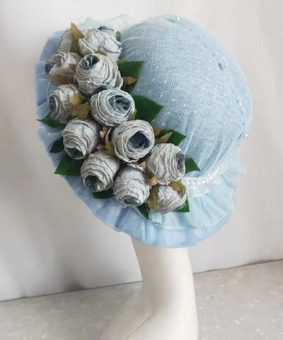Elegante sombrero de pescador francés con encaje morado y flores